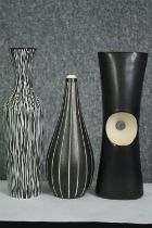 A vintage Midwinter art vase along with two other similar vases. H.26cm. (largest).