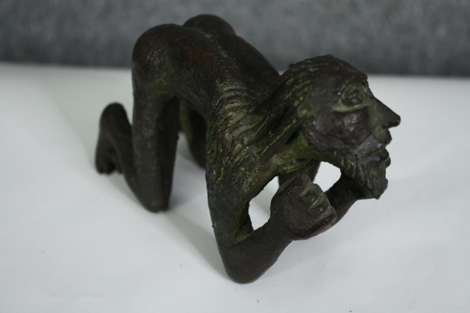 A bronze figure of a crouching man, possibly African. H.10cm. - Image 3 of 6
