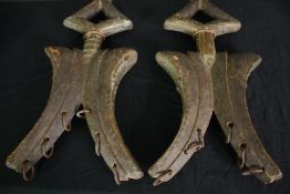 A pair of Gabon Kota two faced reliquary's, carved wood with brass detailing and iron rings. H.54cm.