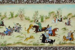 A C.1900 Indo Persian hunting scene in a well inlaid frame. H.29 W.53cm.