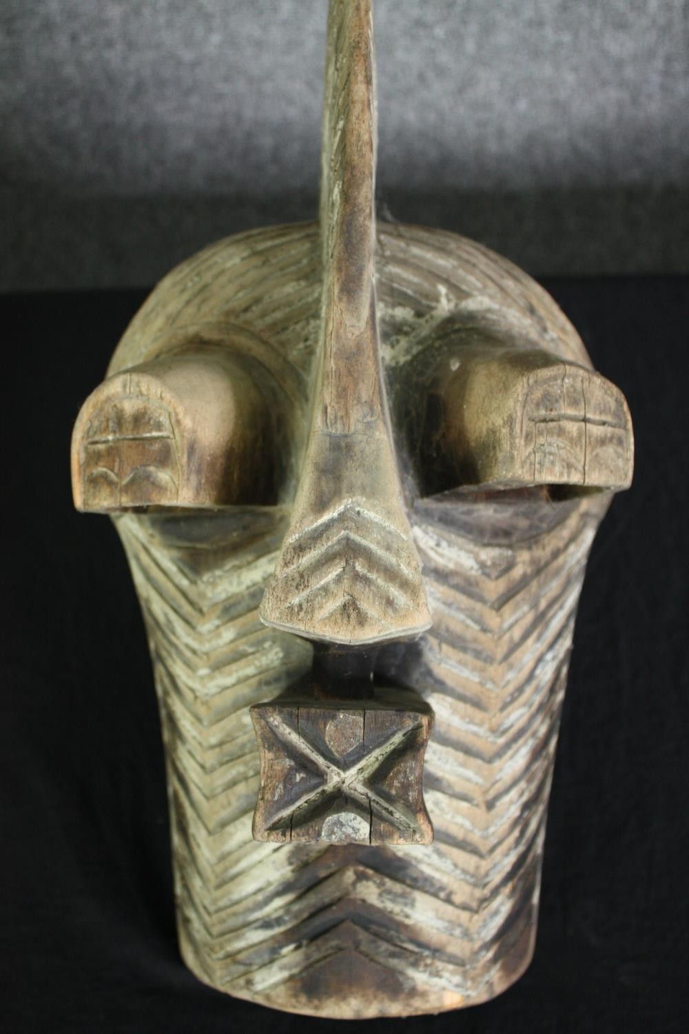 A Congolese Kifwebe Songye mask along with a painted tribal mask. H.55cm. (largest). - Image 3 of 10