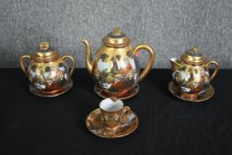 A 19th century Japanese Meiji satsuma coffee set, hand decorated with gilt highlights, character