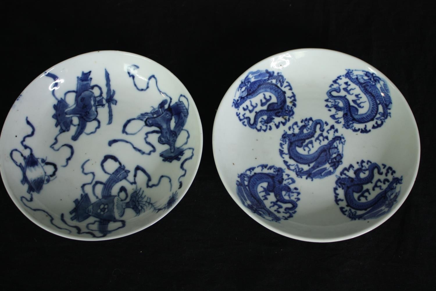 Two 19th century Chinese blue and white hand painted porcelain plates, one with five dragons in