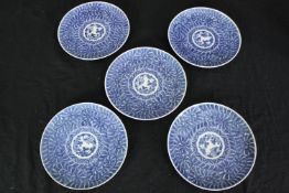 A set of early 20th century Chinese blue and white hand painted dishes with stylised floral and
