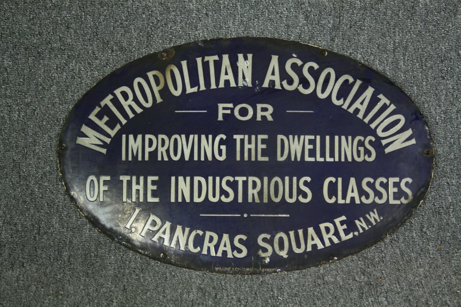 A 19th century enamel building plaque. H.38 W.61cm.