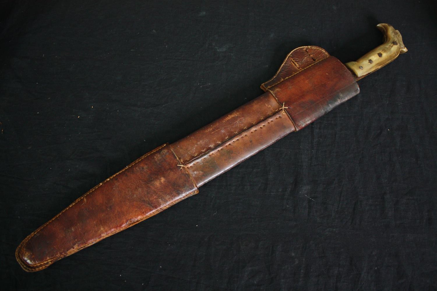 A sword with engraved blade in stitched leather scabbard, possibly a central American saddle - Image 2 of 10