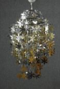 A contemporary gold and silver sheet metal flower waterfall ceiling lamp. H.72 Dia.60cm.