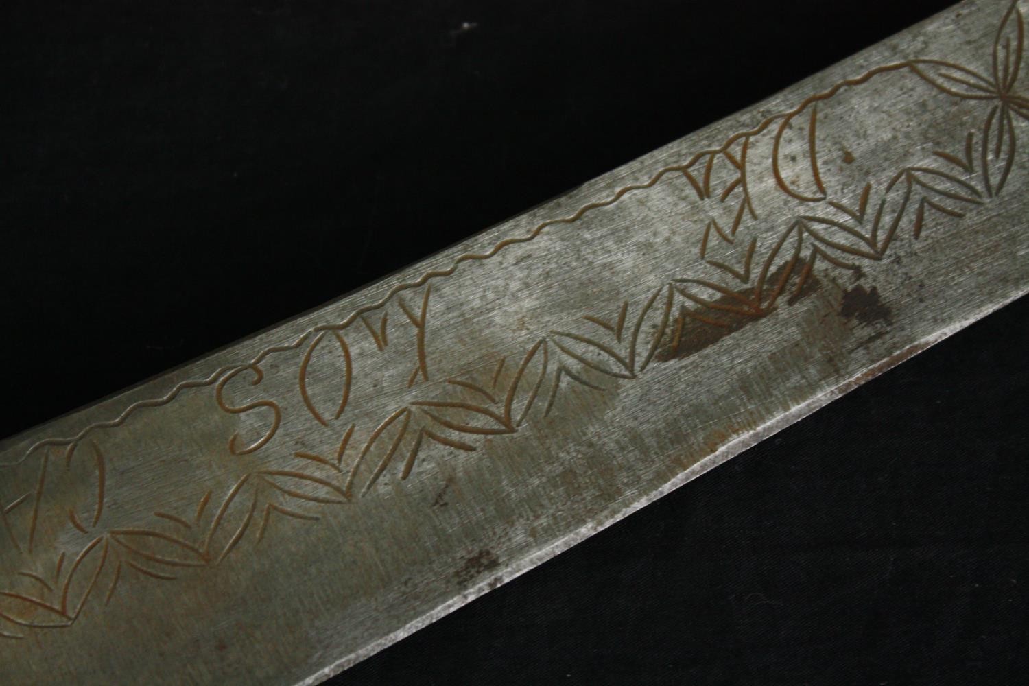 A sword with engraved blade in stitched leather scabbard, possibly a central American saddle - Image 6 of 10