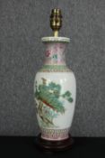 An early 20th century Chinese Famille rose peacock design vase converted to table lamp. Mounted on a