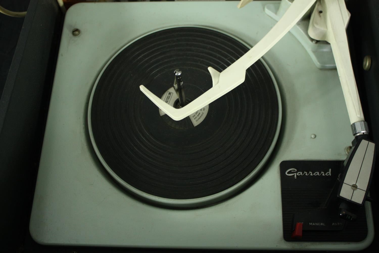 A vintage portable turntable / record player, Garrard in a Bush case. H.24 W.38 D.44cm. - Image 4 of 7
