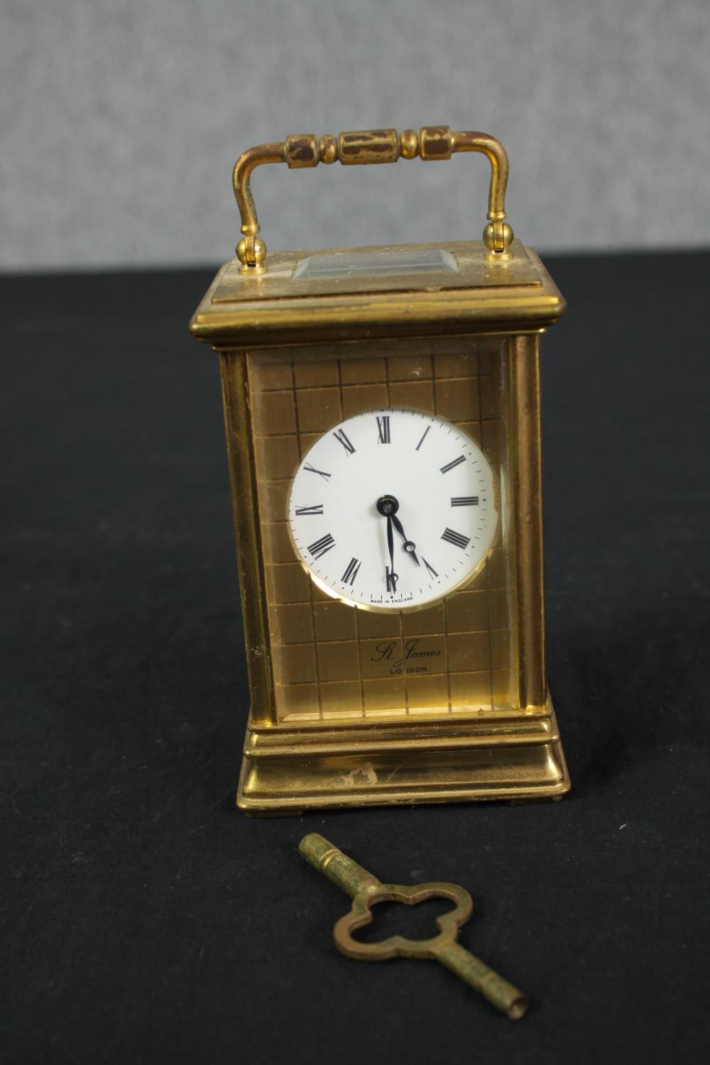 A St James London brass carriage clock with white enamel dial and black roman numerals. With key. - Image 3 of 5