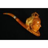 A leather cased Jubilee meerschaum pipe with carved bowl in the form of queen Victoria. The fitted