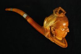 A leather cased Jubilee meerschaum pipe with carved bowl in the form of queen Victoria. The fitted