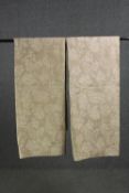 A pair of fully lined beige coloured velour and silk mix curtains with cream scrolling foliate