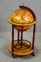 A vintage drinks cabinet in the form of a globe. H.87 Dia.47cm.