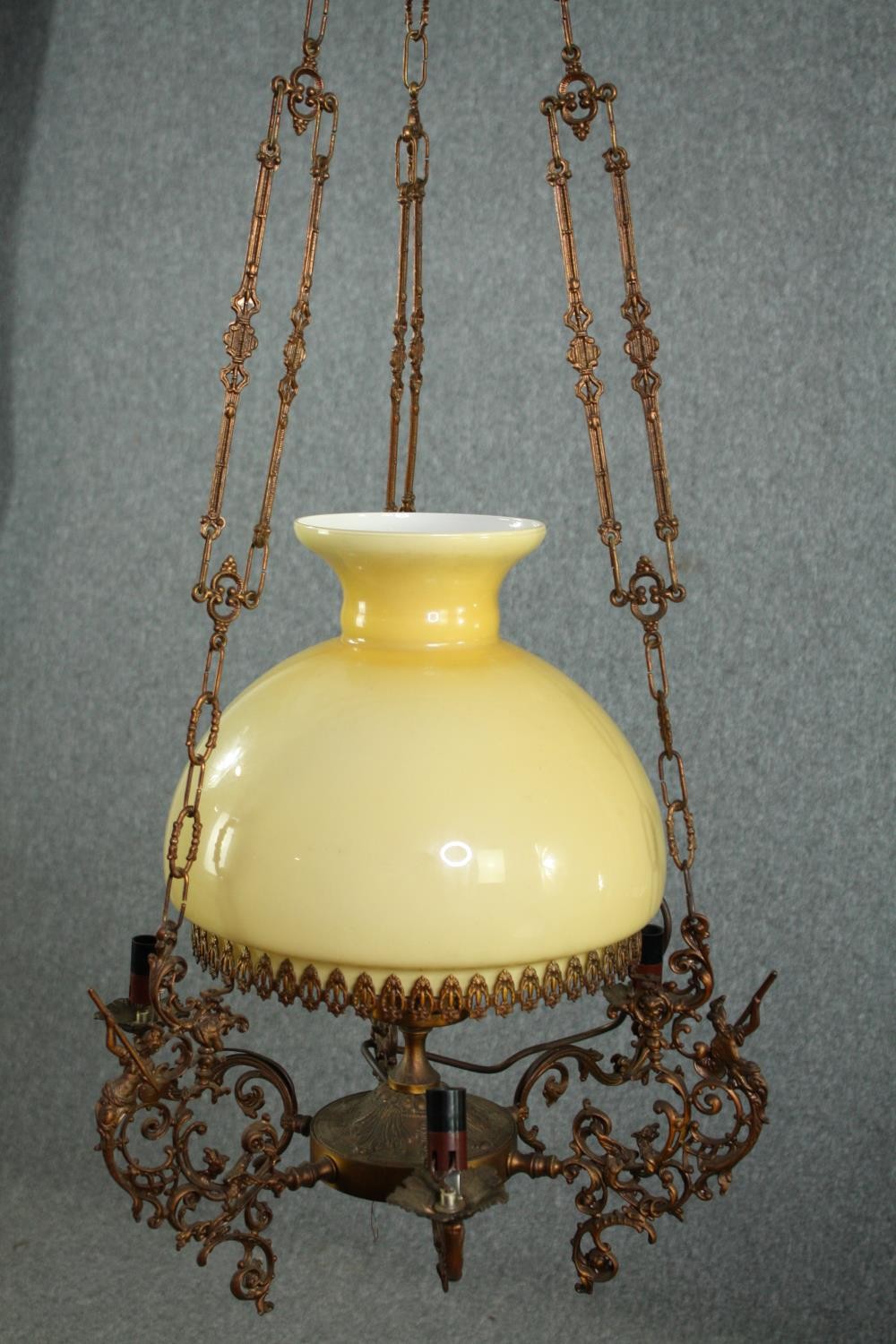 A vintage ceiling light in the style of an oil lantern. H.100cm.