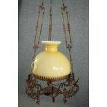 A vintage ceiling light in the style of an oil lantern. H.100cm.