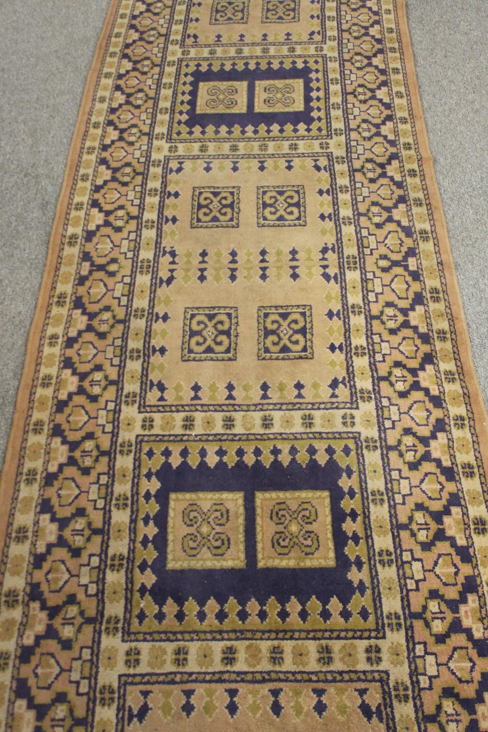 An Eastern runner with geometric design within multiple borders. L.330 W.92cm. - Image 4 of 4