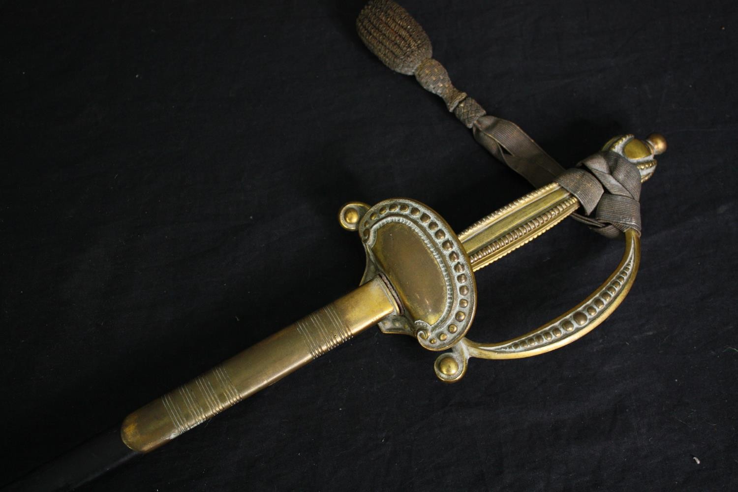 A 19th century officer's dress sword with dress knot and etched blade in brass mounted leather - Image 2 of 6