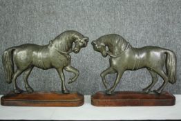 A pair of 19th century brass horse figures on wooden plinths. H.23cm. (each).