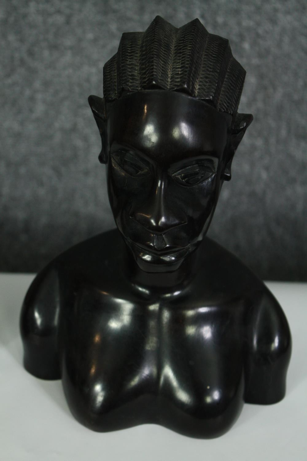 A pair of African carved ebony busts; male and female. H.23cm. (each). - Image 2 of 8