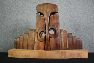 A carved hardwood abstract figure group. H.54 W.80 D.21cm.