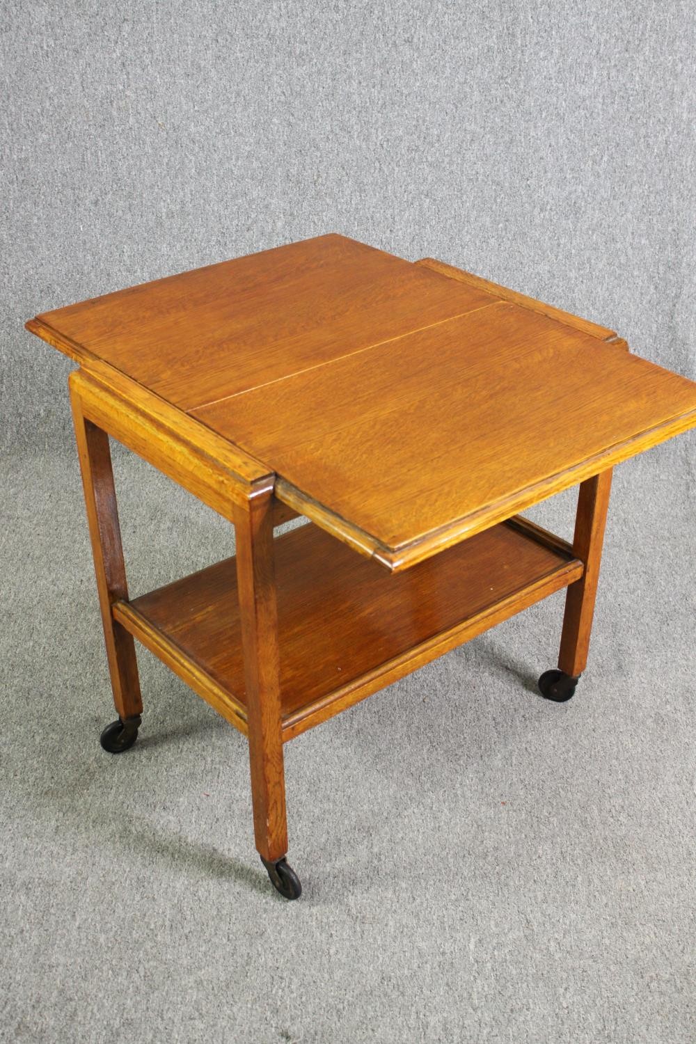 A mid century light oak serving or drinks trolley with spring action drop side. H.66 W.80 D.64cm. - Image 5 of 7