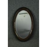 A vintage wall mirror with bevelled plate. H.82 W.52cm.