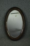 A vintage wall mirror with bevelled plate. H.82 W.52cm.