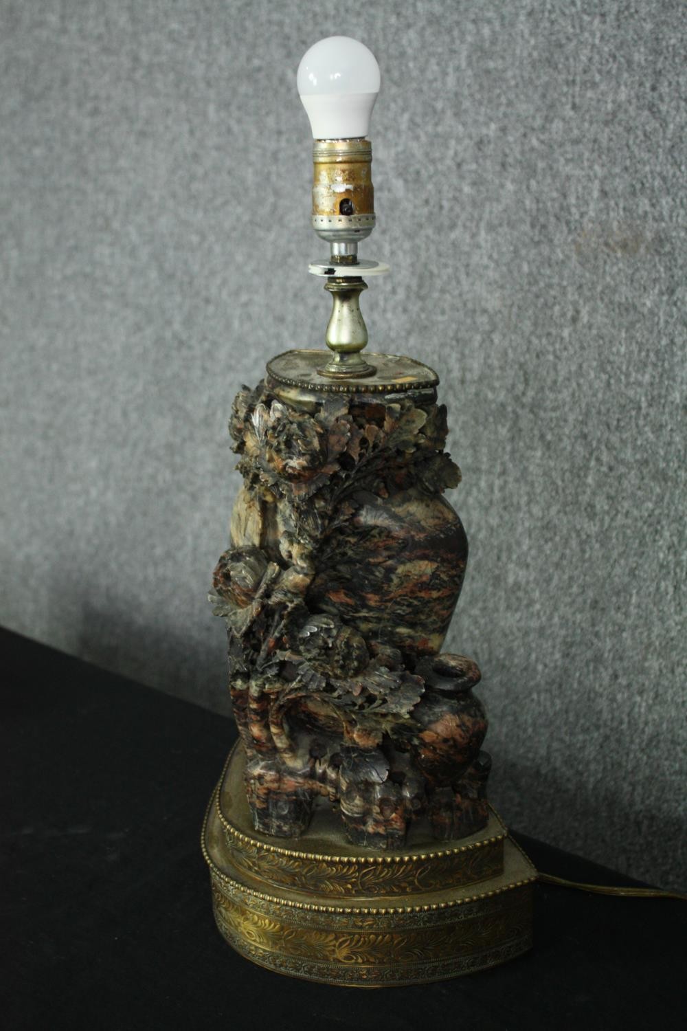 A early 20th century Chinese carved soapstone vase and flowers form lamp, mounted on a two tiered - Image 3 of 7