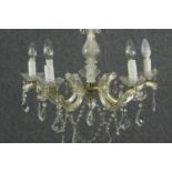 A 20th century five branch chandelier with crystal swags and drops. H.56 Dia.60cm.