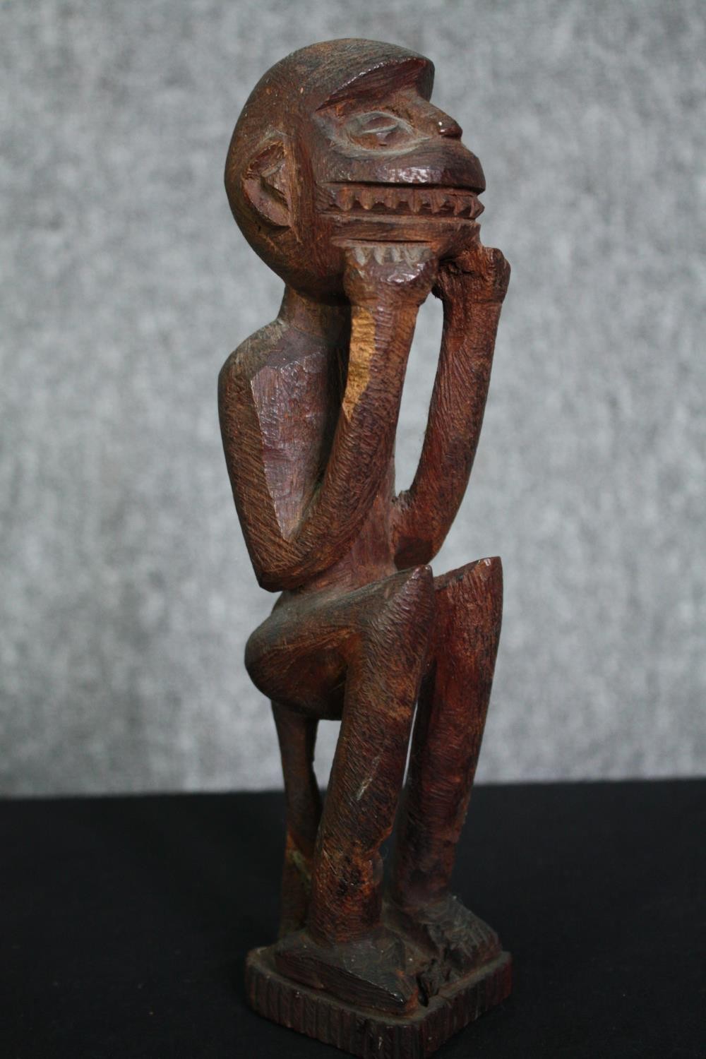 A carved Eastern hardwood figure of a goddess, an African carving and a central American carved - Image 8 of 15