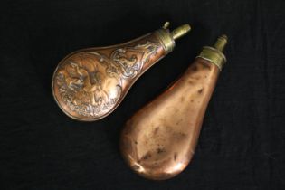 Two 19th century copper and brass shot flasks. L.20cm. (largest).