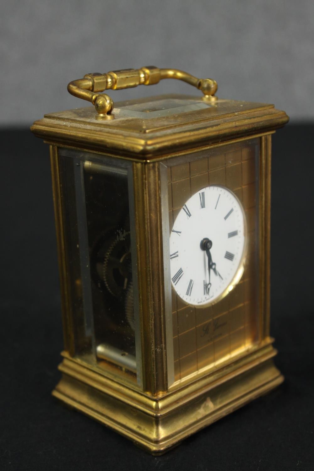 A St James London brass carriage clock with white enamel dial and black roman numerals. With key. - Image 2 of 5