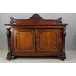 Sideboard, 19th century mahogany with central panelled doors flanked by fruit carved pilasters on