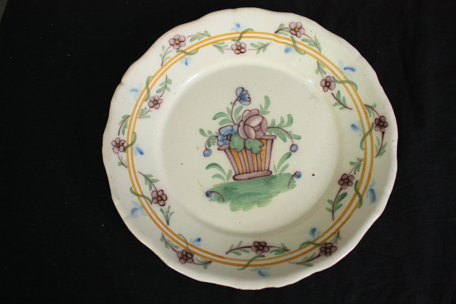A collection of 19th century faience plates. One damaged. Dia.34cm. (largest). - Image 2 of 11