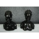A pair of African carved ebony busts; male and female. H.23cm. (each).