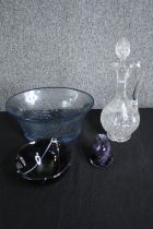 A cut crystal decanter and stopper, an etched glass blue bowl and two art glass pieces. H.33cm. (