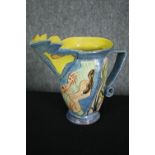 An art pottery jug, signed and dated. H.24cm.