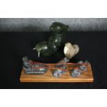 Carved stone polar figures: metamorphic walrus and bear, sledge, etc. L.36cm. (largest).