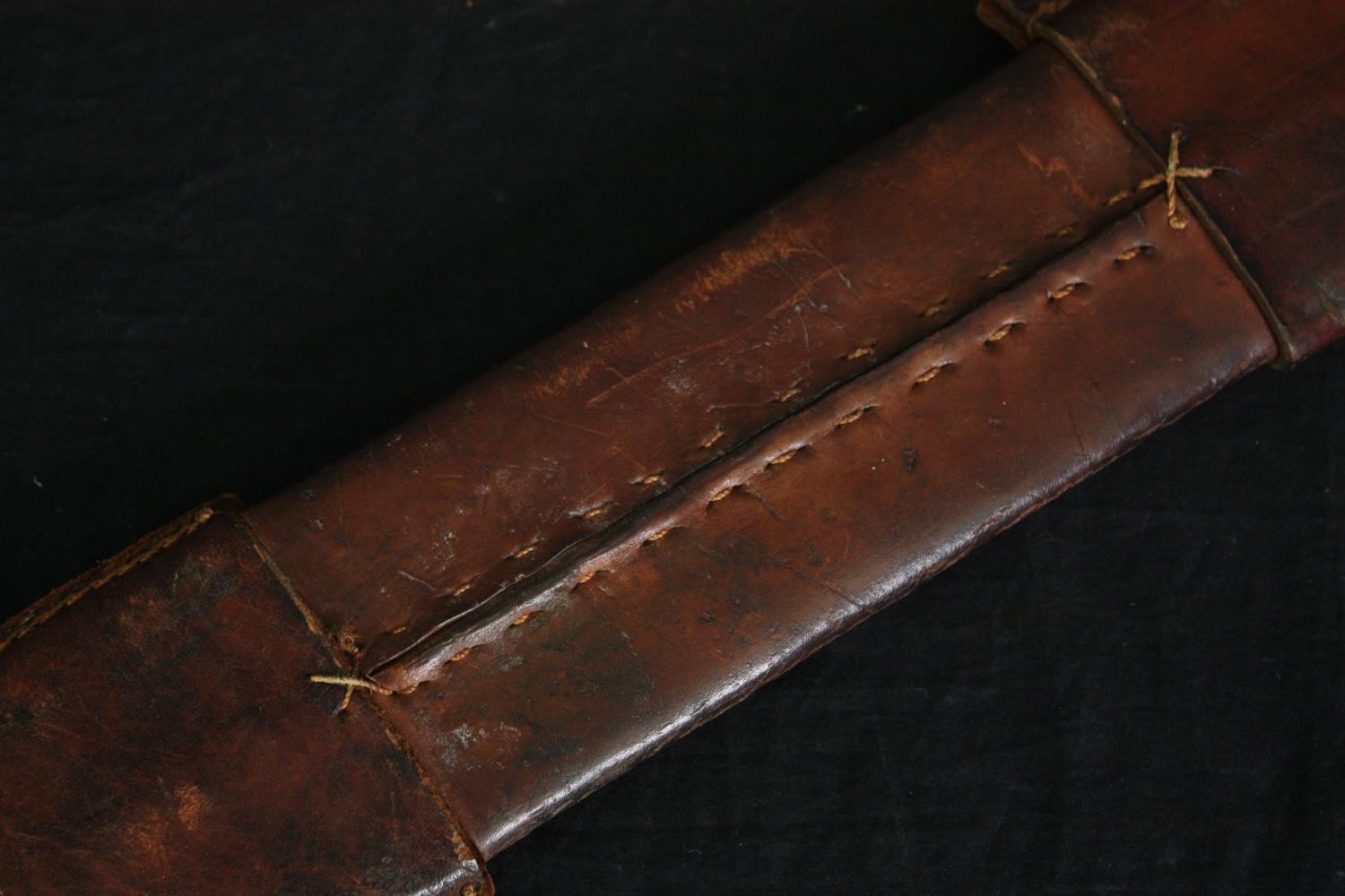 A sword with engraved blade in stitched leather scabbard, possibly a central American saddle - Image 3 of 10