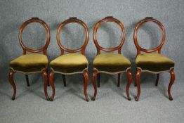 Dining chairs, a set of four Victorian carved walnut.