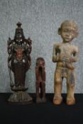 A carved Eastern hardwood figure of a goddess, an African carving and a central American carved