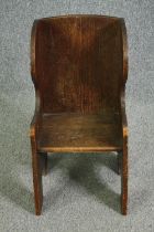 An 18th century country oak child's chair settle. H.70cm.