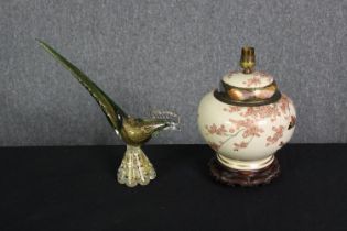 A vintage Chinese hand decorated baluster lamp on carved hardwood base along with a vintage art