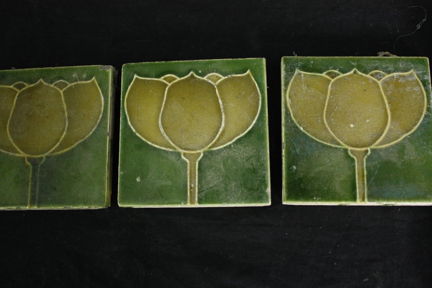Three 19th century Art Nouveau tiles, three framed decorative tiles and a cased geometry set. L. - Image 5 of 8