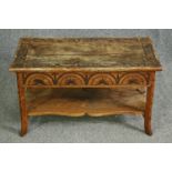 A carved oak low table. H.45 W.75 D.37cm.