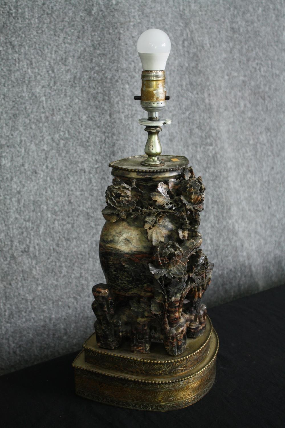 A early 20th century Chinese carved soapstone vase and flowers form lamp, mounted on a two tiered - Image 2 of 7