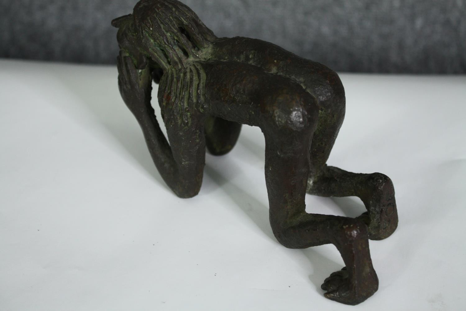 A bronze figure of a crouching man, possibly African. H.10cm. - Image 5 of 6