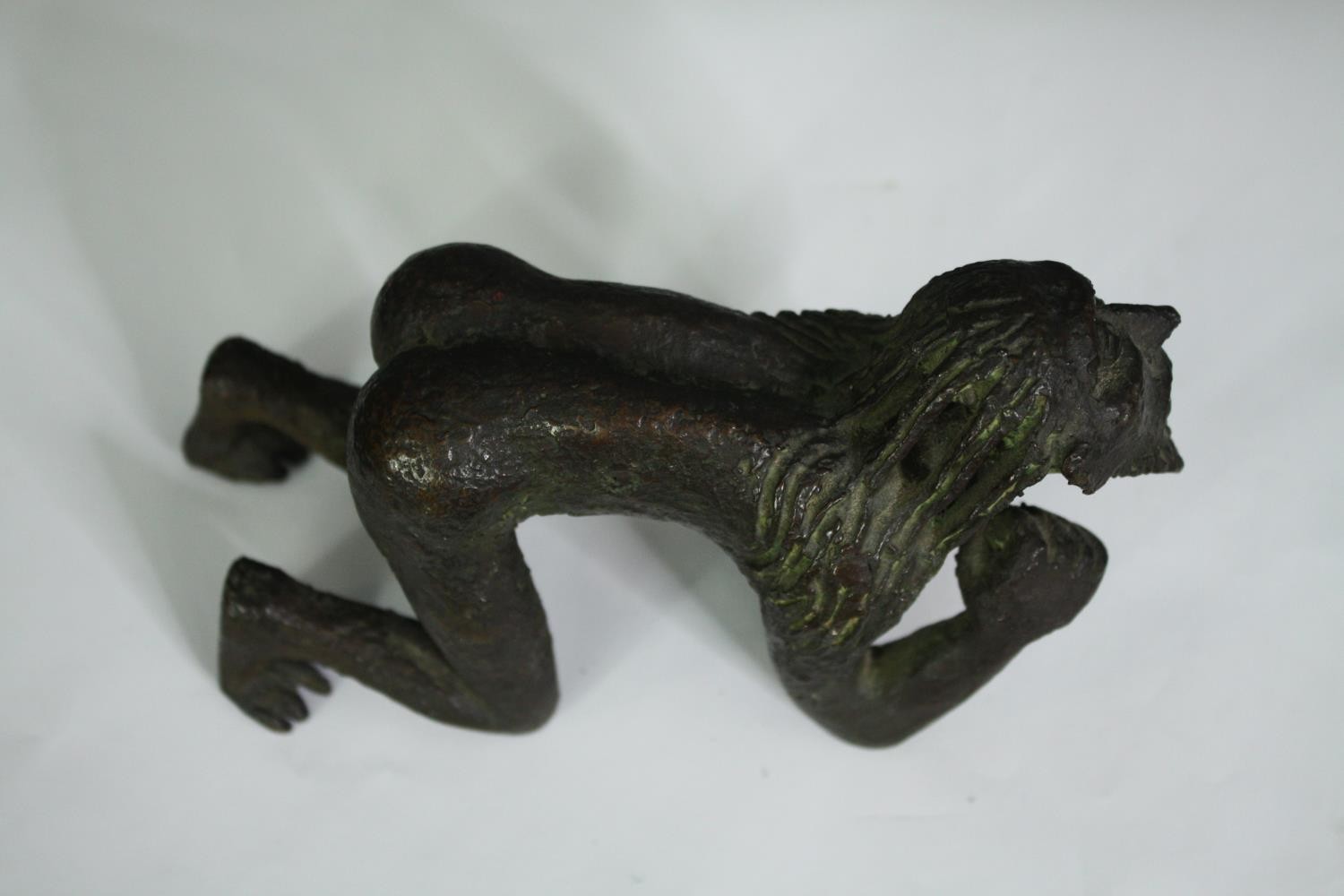 A bronze figure of a crouching man, possibly African. H.10cm. - Image 2 of 6